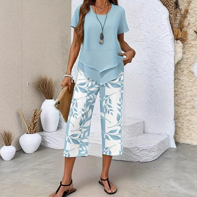 👗 SADA 50% POPUSTA 🌿 Ležerni komplet tunike s okruglim izrezom i slojevitih hlača širokih nogavica – Asimetrični rub, print i prozračne hlače ✨